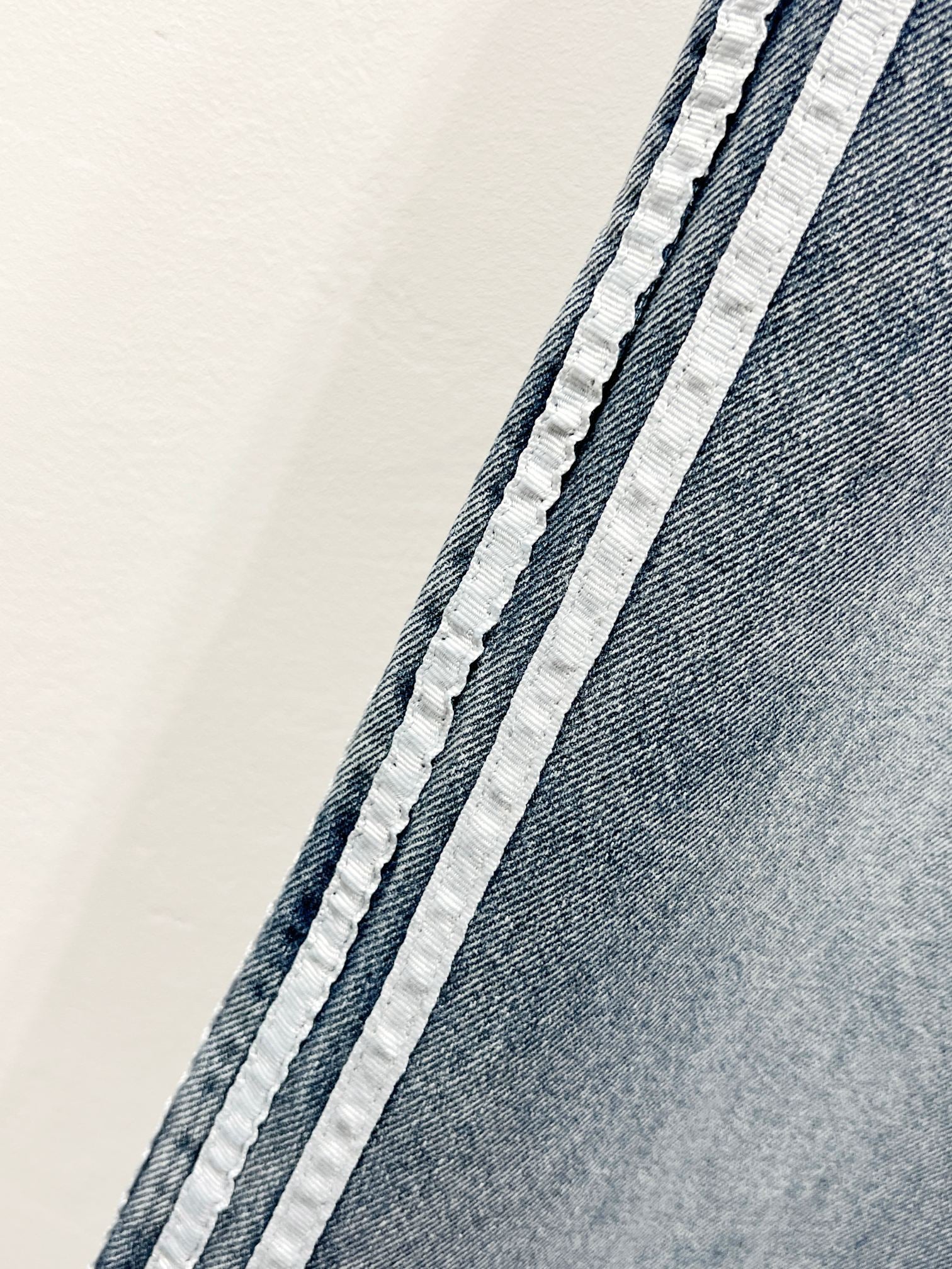 Light blue denim with white contrast side stripe and stitched edges