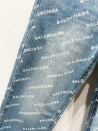Light blue denim fabric with repeating BALENCIAGA logo pattern, diagonal texture