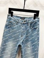 Blue logo-print denim pants hanging on a rack, straight leg and belt loops