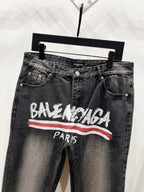 Black denim pants with Balenciaga Paris graphic, button fly, side pockets