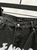 Black denim pants with Balenciaga label on waistband and metal button closure