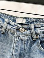Light-wash denim pants with button, fly, and belt-loop hardware