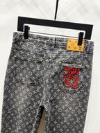Louis Vuitton monogram jeans with belt loops and red logo side pocket