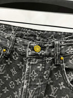 Louis Vuitton monogram denim jeans with yellow logo patch and button