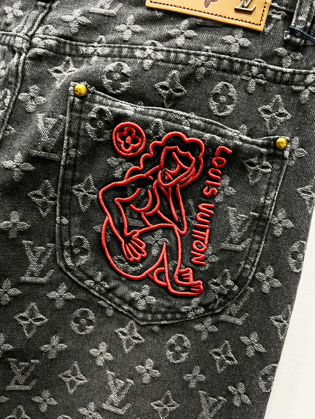 Louis Vuitton monogram denim jeans pocket with red embroidered logo