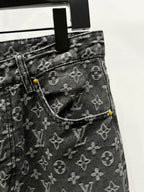 Louis Vuitton monogram denim jeans with front pocket seam and yellow button