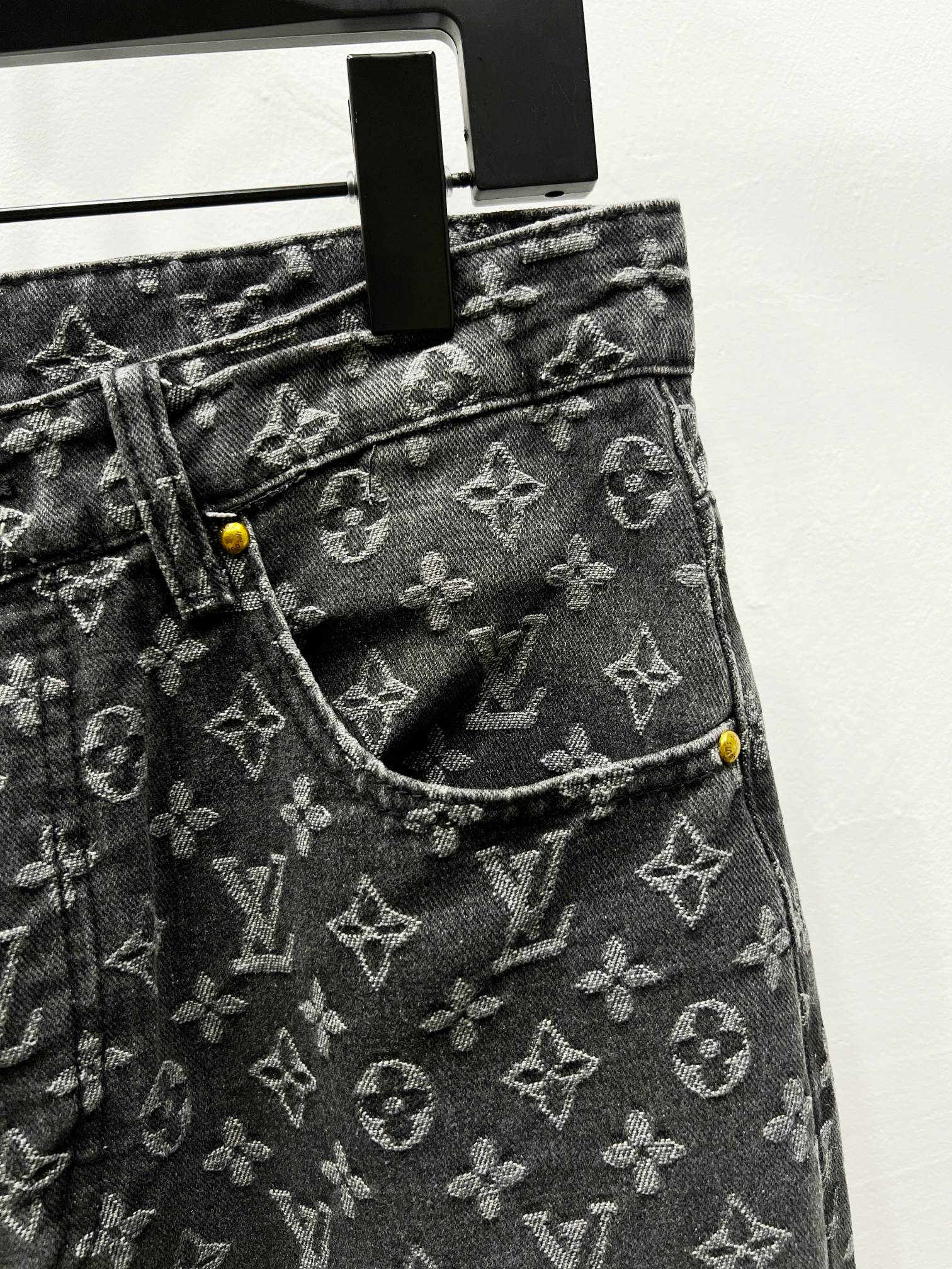 Louis Vuitton monogram denim jeans with front pocket seam and yellow button
