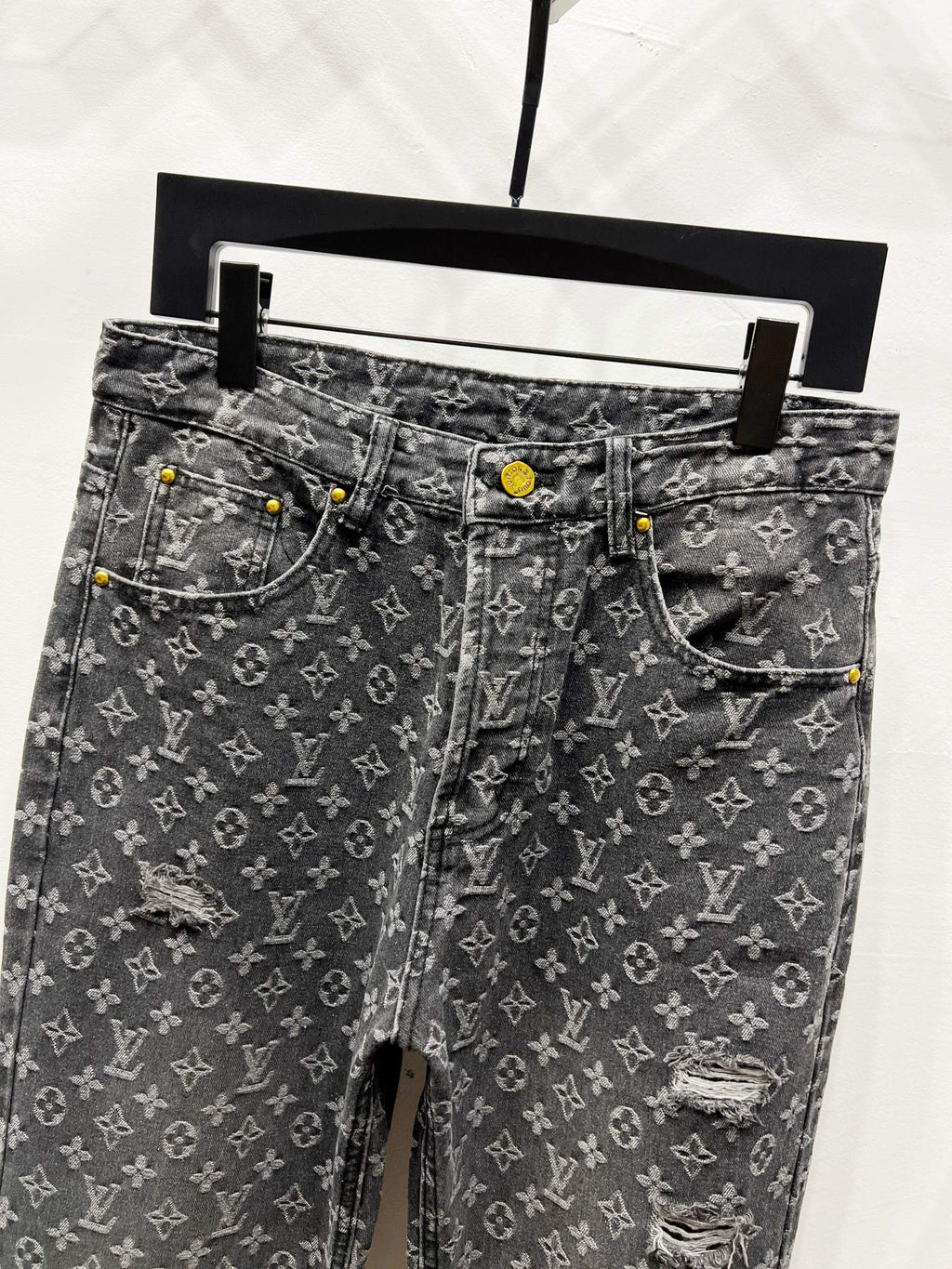 Louis Vuitton monogram denim jeans with distressing, front view