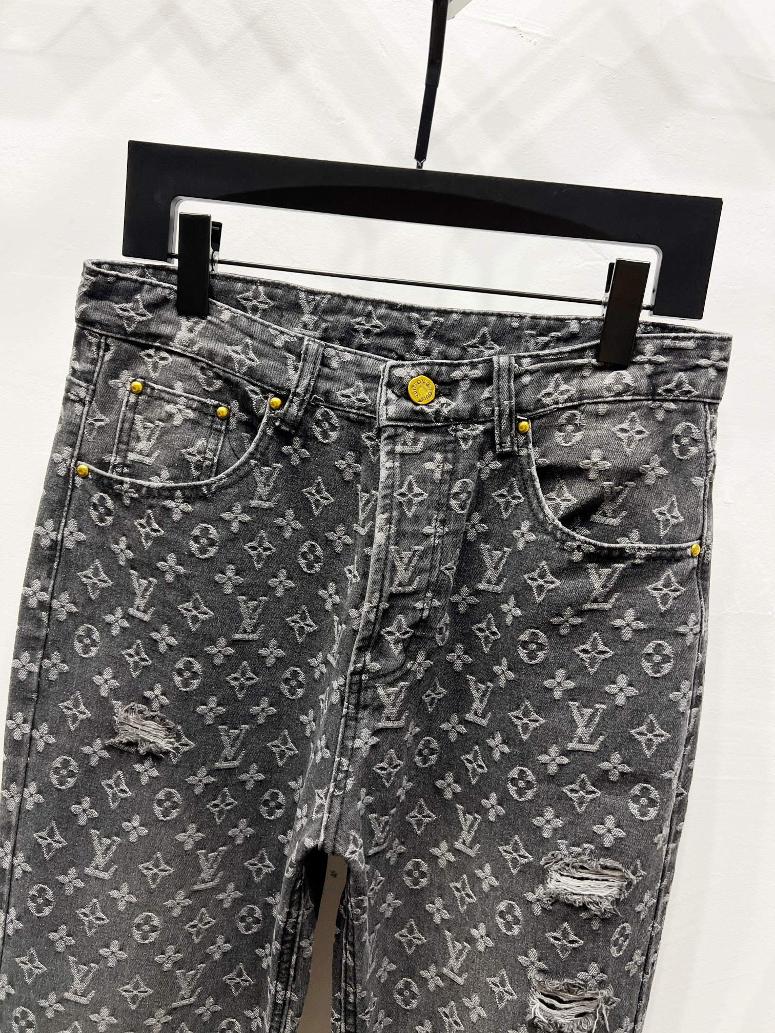 Louis Vuitton monogram denim jeans with distressing, front view
