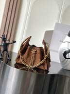 Chanel suede shoulder bag in tan-brown with gold chain strap and flap closure