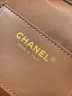 Chanel logo label and 'Made in Italy' on tan-brown suede bag
