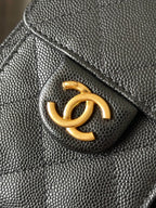 Black Chanel quilted leather flap with gold CC logo detail