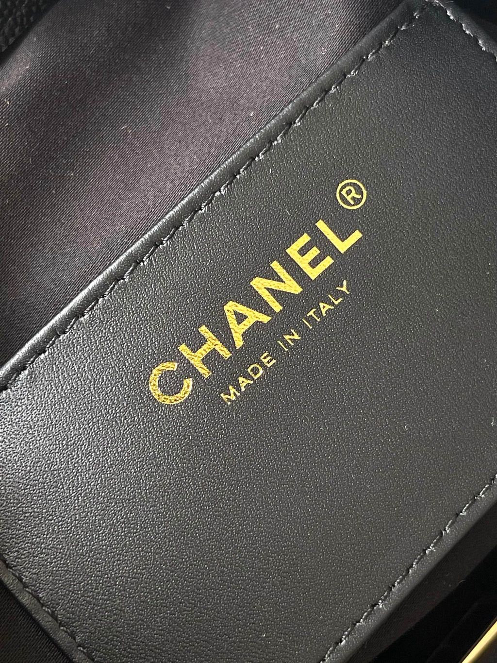 Chanel bag interior label reading Chanel and Made in Italy