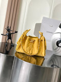 Chanel quilted shoulder bag in yellow with gold chain strap and flap front