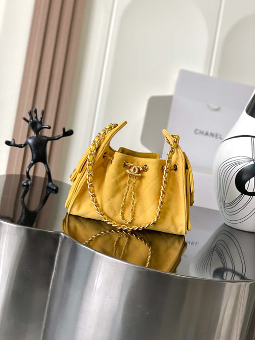 Chanel quilted shoulder bag in yellow with gold chain strap and flap front