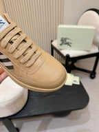 Burberry sneaker side view in beige leather with lace-up details and check accent