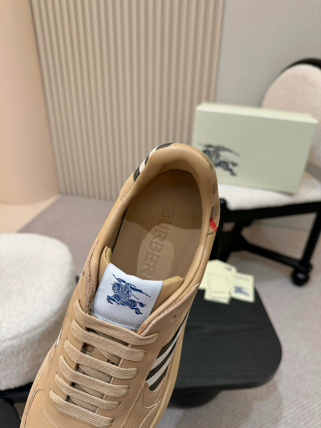 Burberry beige sneaker interior view with lace-up front and check side panel
