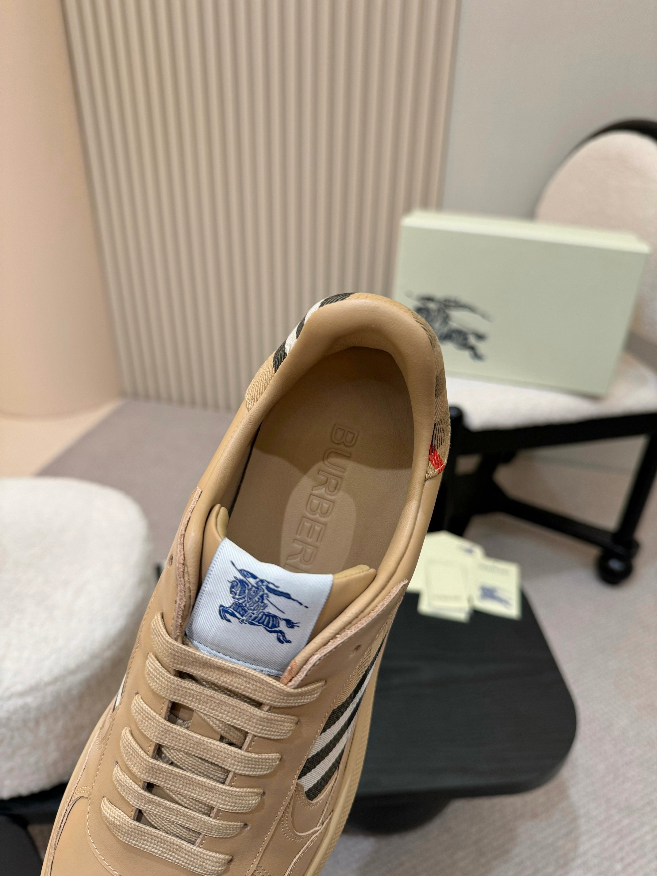 Burberry beige sneaker interior view with lace-up front and check side panel