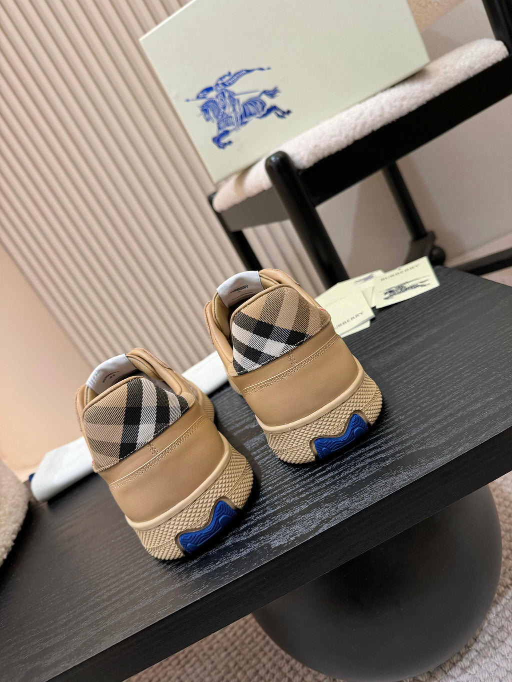 Burberry sneakers heel view, beige uppers with check detail and blue tabs