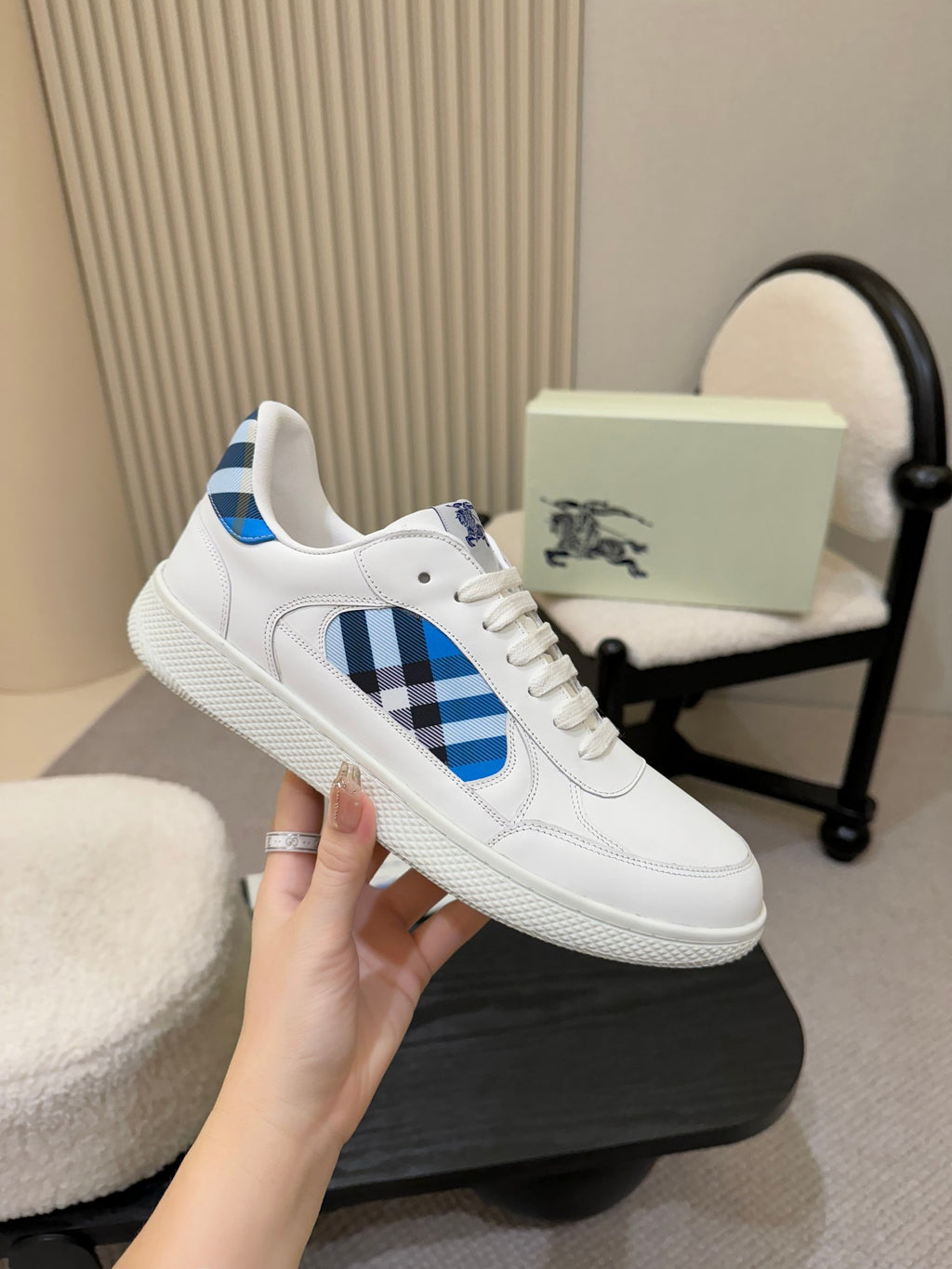White lace-up sneaker with blue plaid quarter panel and textured sole