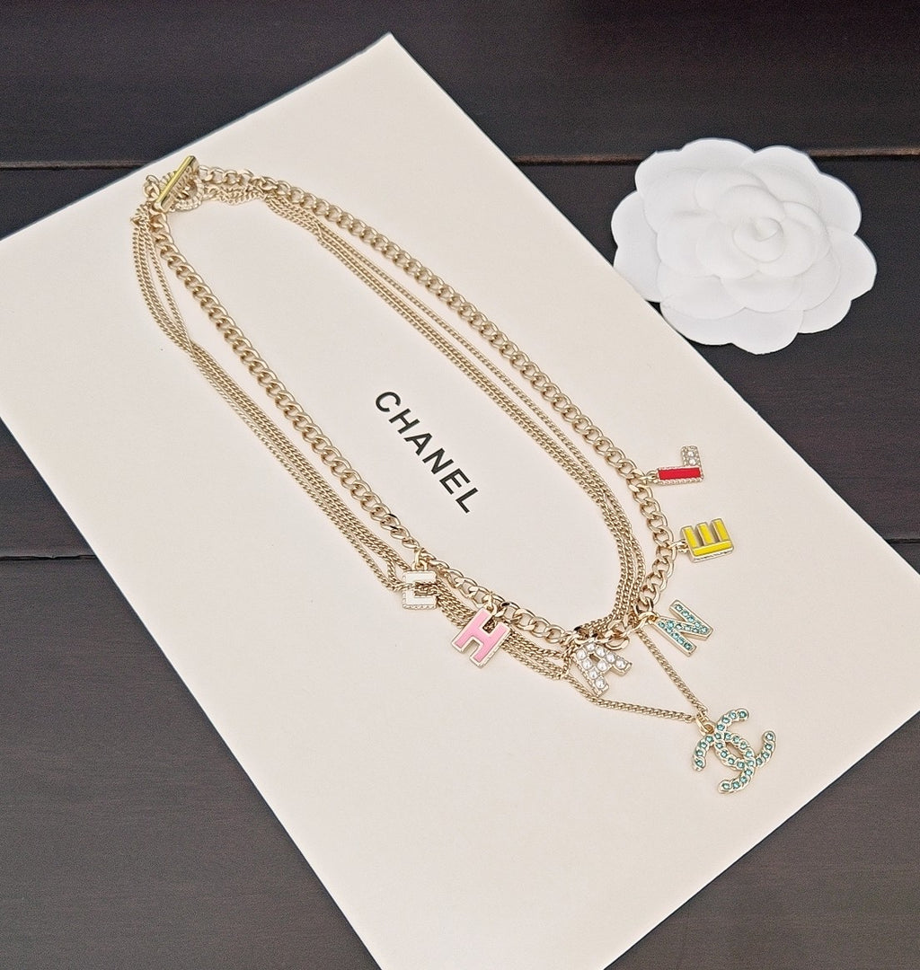 Gold-tone Chanel chain necklace with multicolor H, A, N, E letter charms and CC pendant