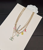 Gold-tone Chanel chain necklace with multicolor letter charms and CHANEL pendant