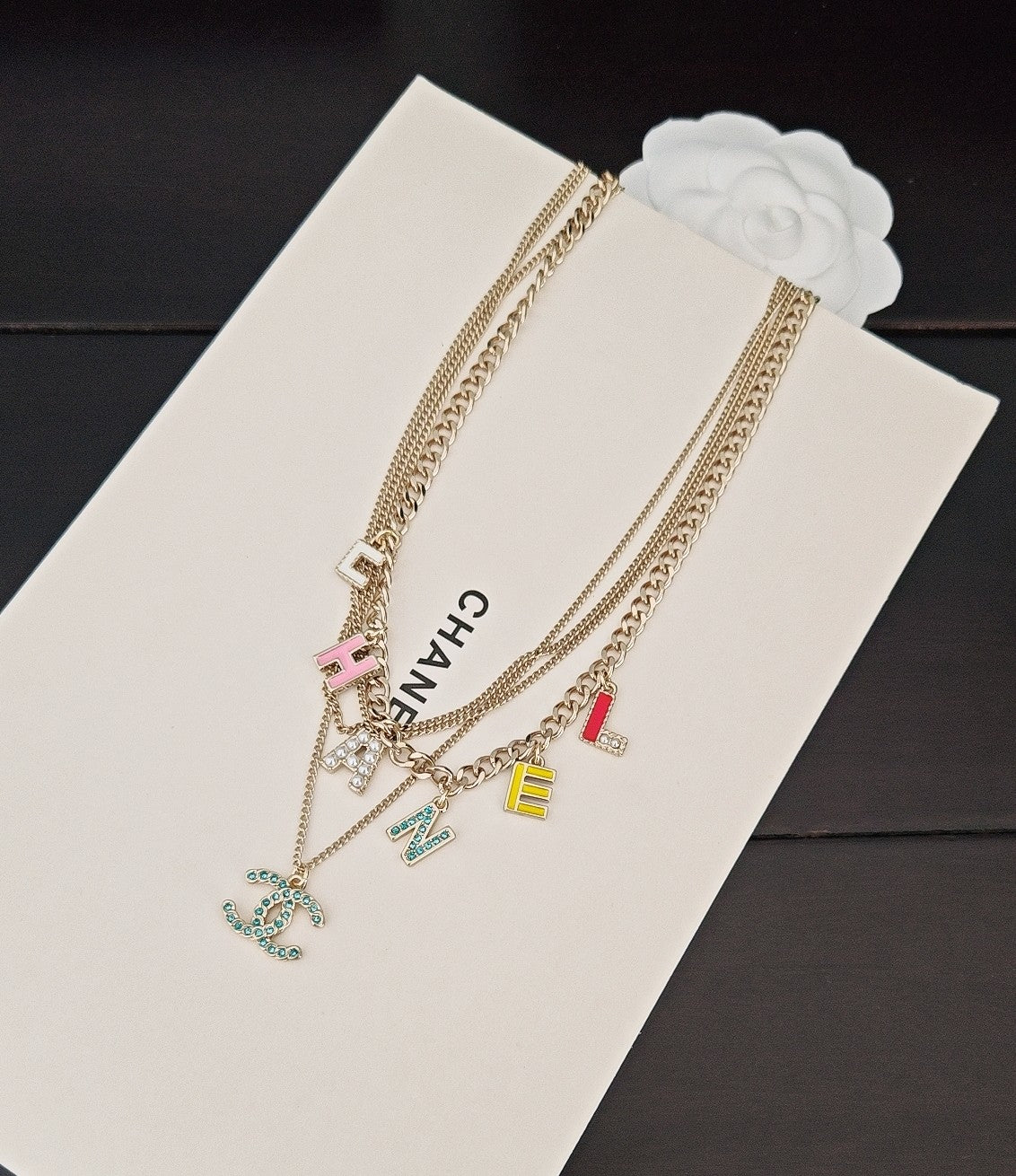 Gold-tone Chanel chain necklace with multicolor letter charms and CHANEL pendant