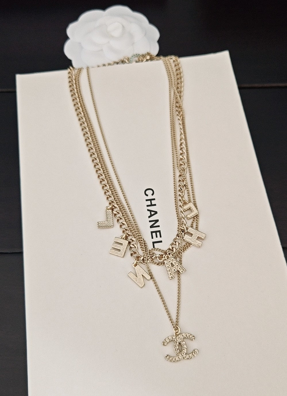 Gold-tone Chanel chain necklace with CHANEL pendant and multicolor letter charms