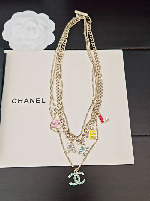 Gold-tone Chanel chain necklace with multicolor letter charms and small CC pendant
