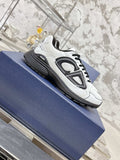 White Dior lace-up sneaker with black ribbed sole, angled side view on box