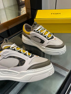 Fendi unisex sneakers pair: white-gray uppers, yellow laces, chunky sole with side logo