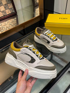 Fendi unisex lace-up sneakers, white and gray uppers with yellow trim, chunky platform sole