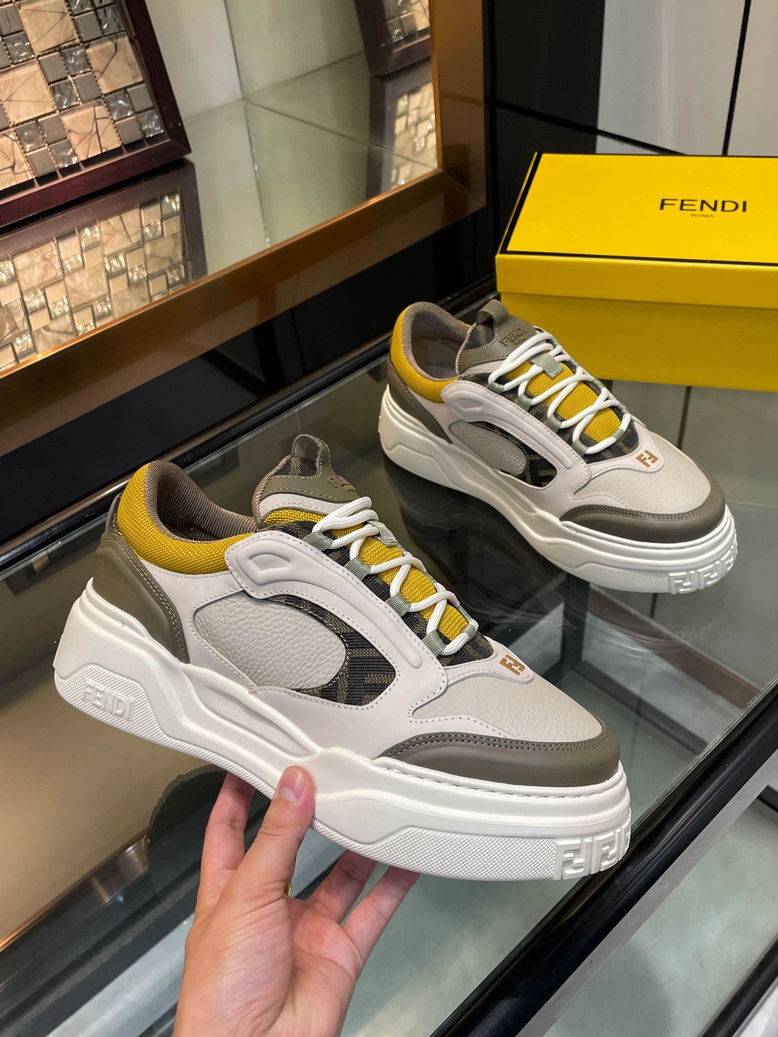 Fendi unisex lace-up sneakers, white and gray uppers with yellow trim, chunky platform sole