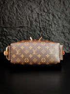 Louis Vuitton monogram canvas barrel bag with gold-tone hardware and short top straps