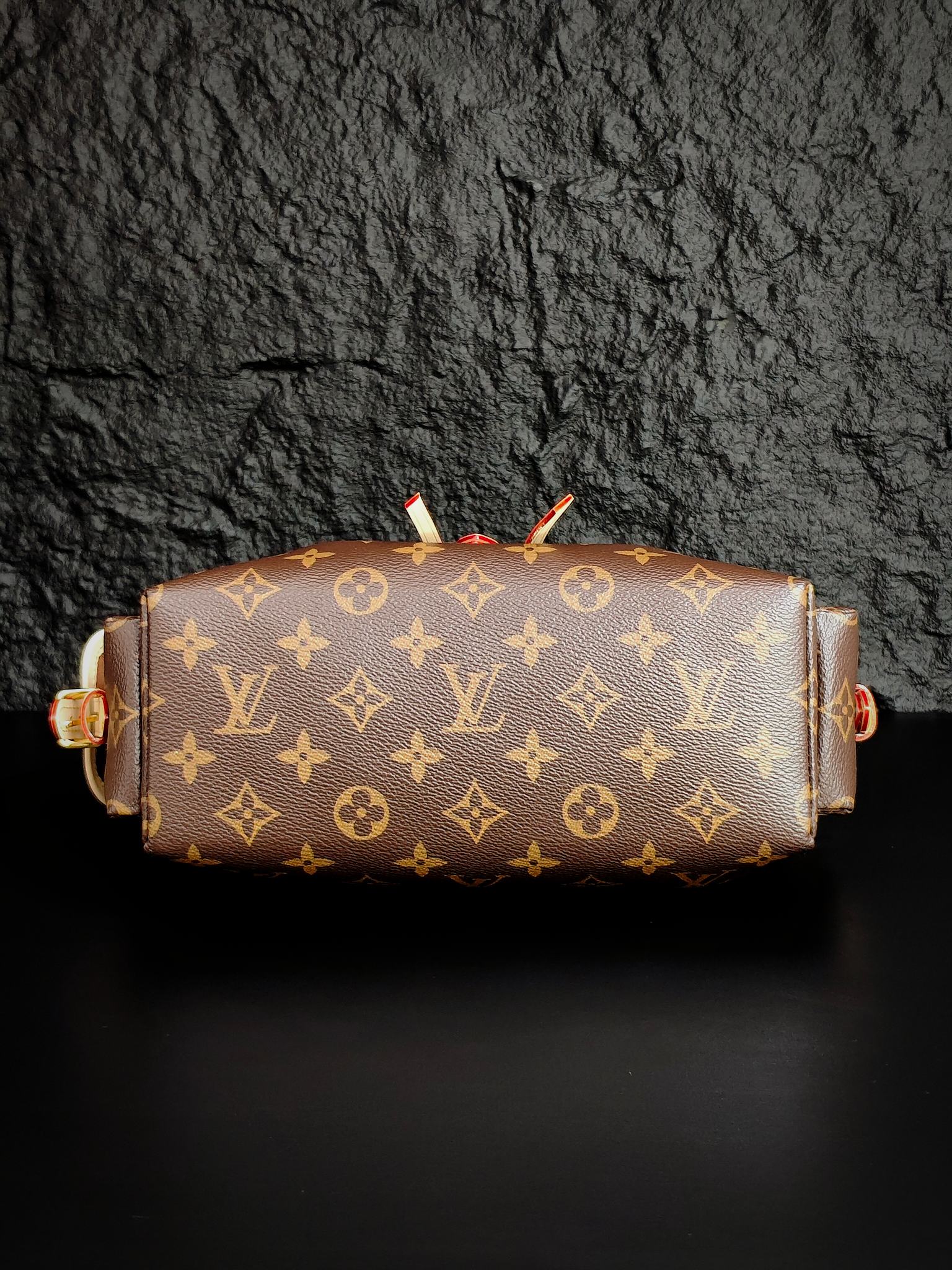 Louis Vuitton monogram canvas barrel bag with gold-tone hardware and short top straps