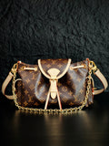 Louis Vuitton monogram canvas mini bucket bag with white leather trim and chain strap