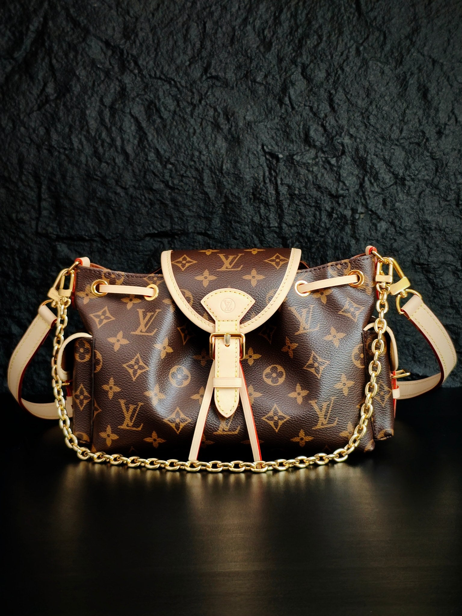 Louis Vuitton monogram canvas mini bucket bag with white leather trim and chain strap