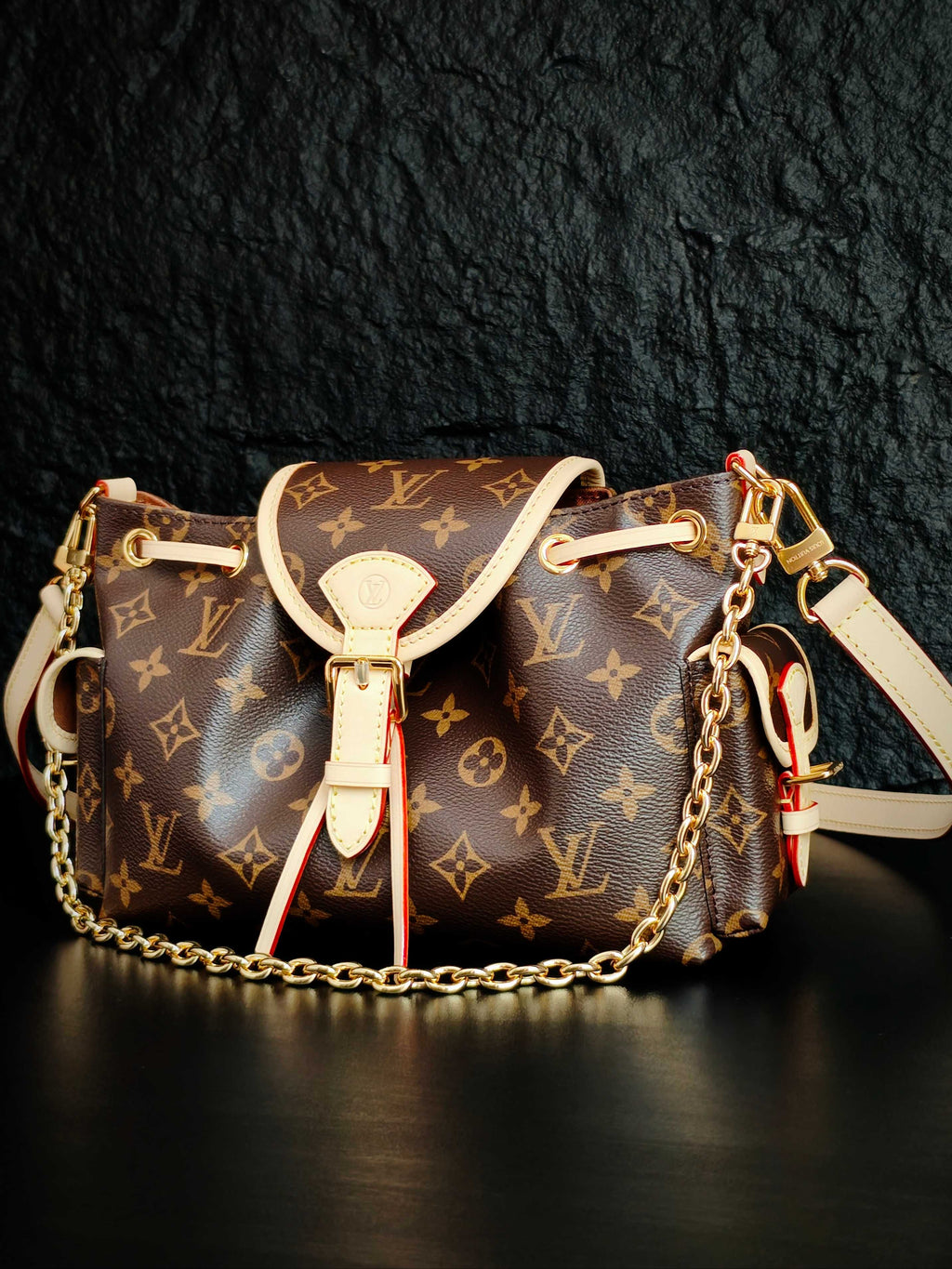 Louis Vuitton monogram canvas crossbody bag with white leather trim and shoulder chain