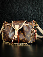 Louis Vuitton monogram canvas crossbody bag with white leather trim and shoulder chain
