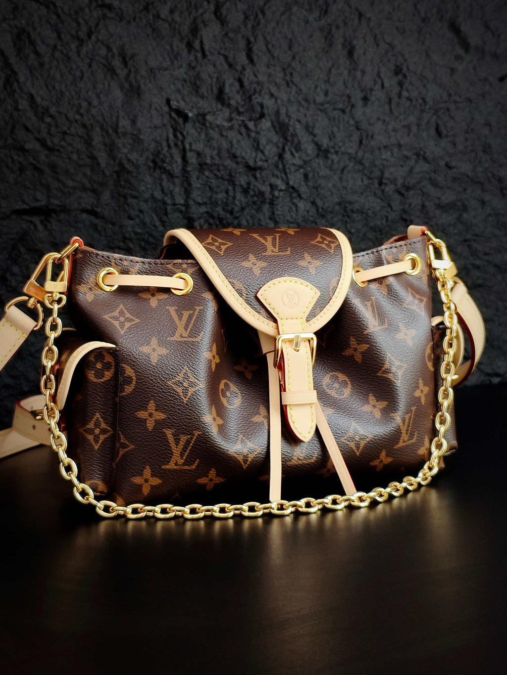 Louis Vuitton monogram canvas mini bag with white bow detail and gold-tone chain strap