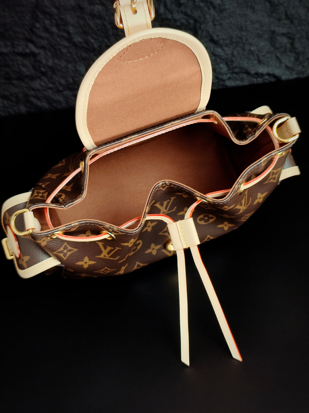 Louis Vuitton monogram canvas mini bag open view with beige interior and leather shoulder strap
