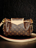 Louis Vuitton monogram canvas crossbody bag with white front flap and long leather strap