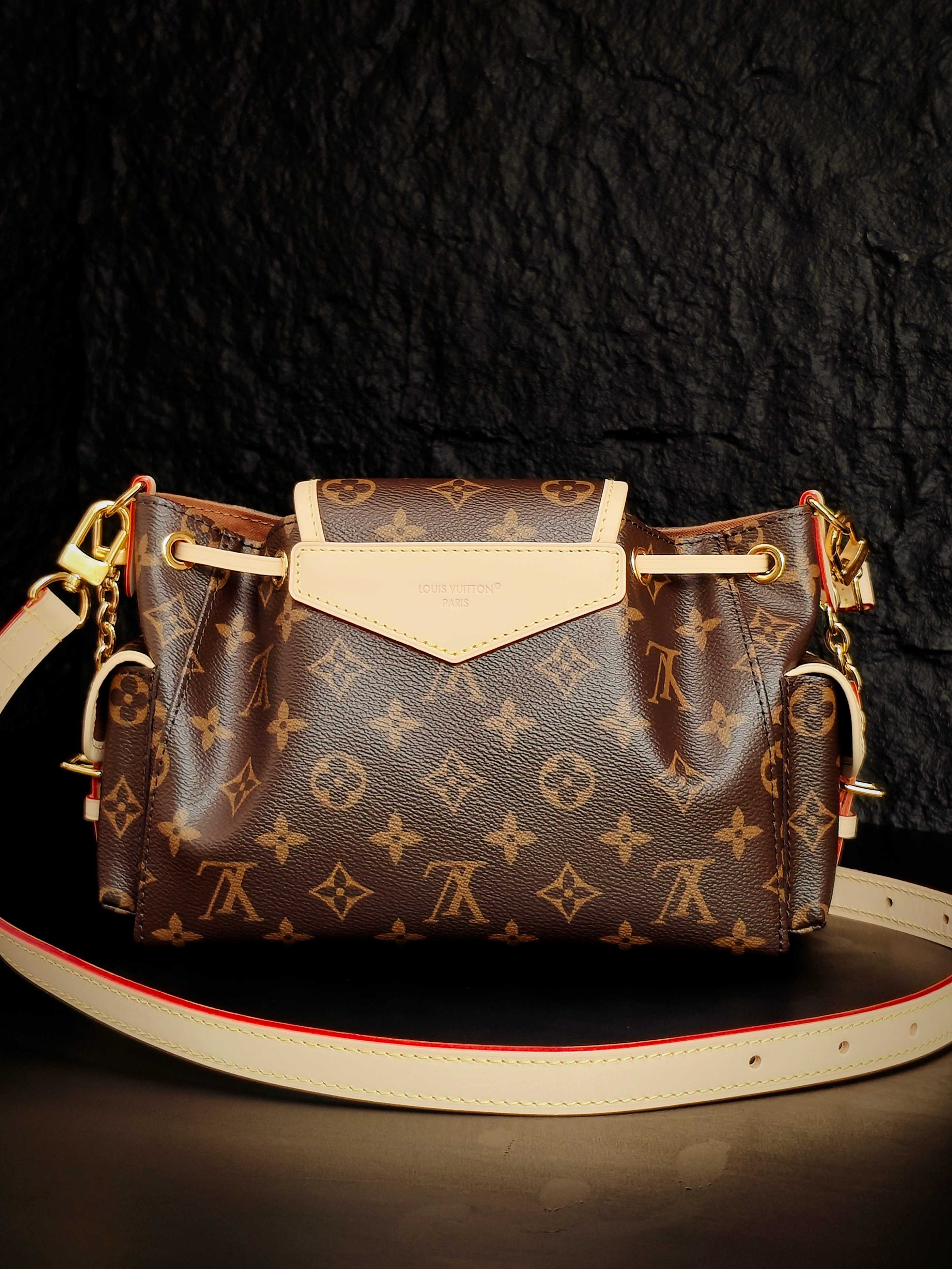 Louis Vuitton monogram canvas crossbody bag with white front flap and long leather strap