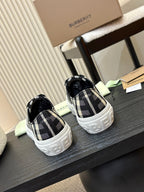 Burberry plaid low-top sneakers pair, black-and-white check uppers with white soles