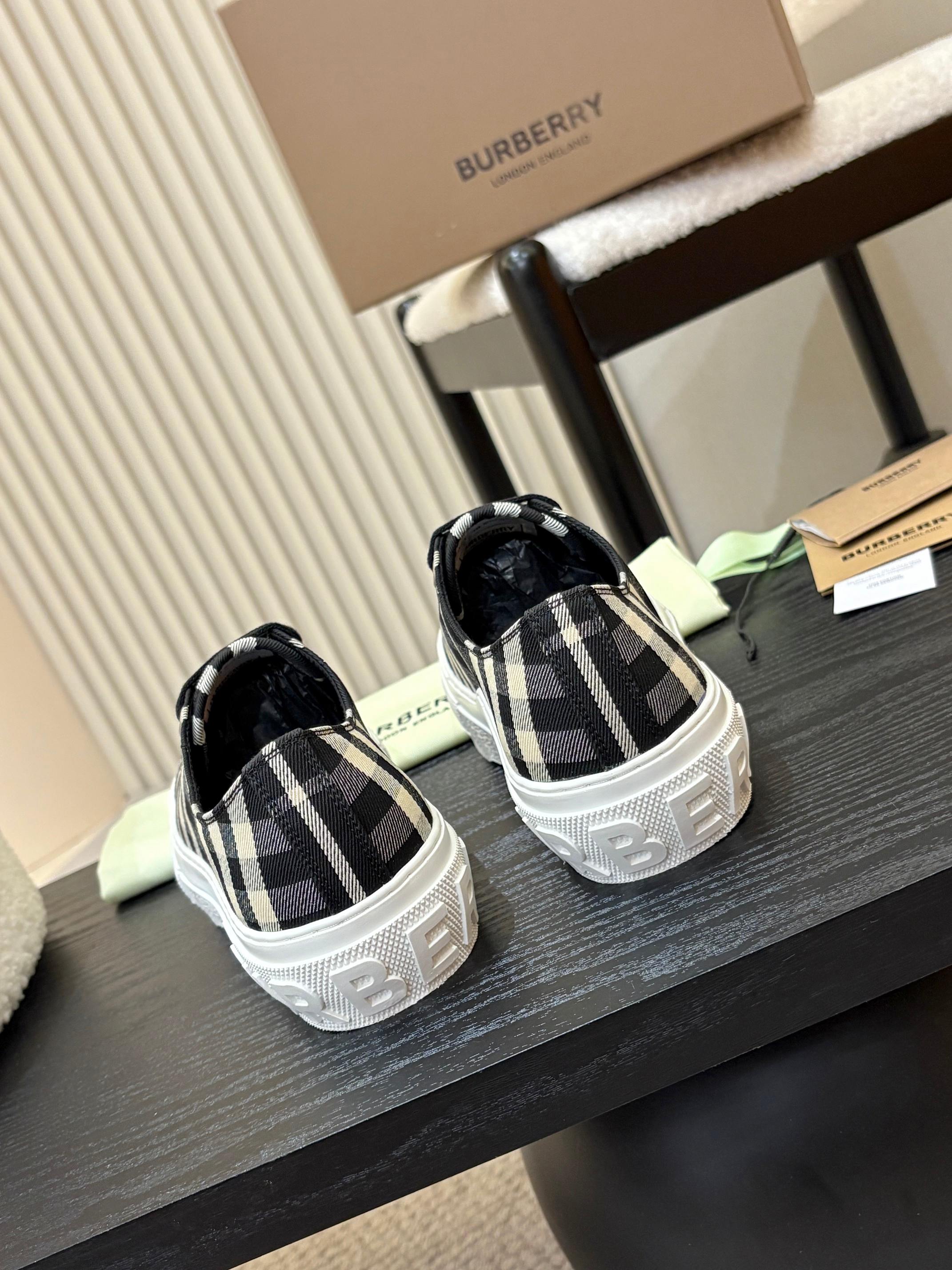 Burberry plaid low-top sneakers pair, black-and-white check uppers with white soles