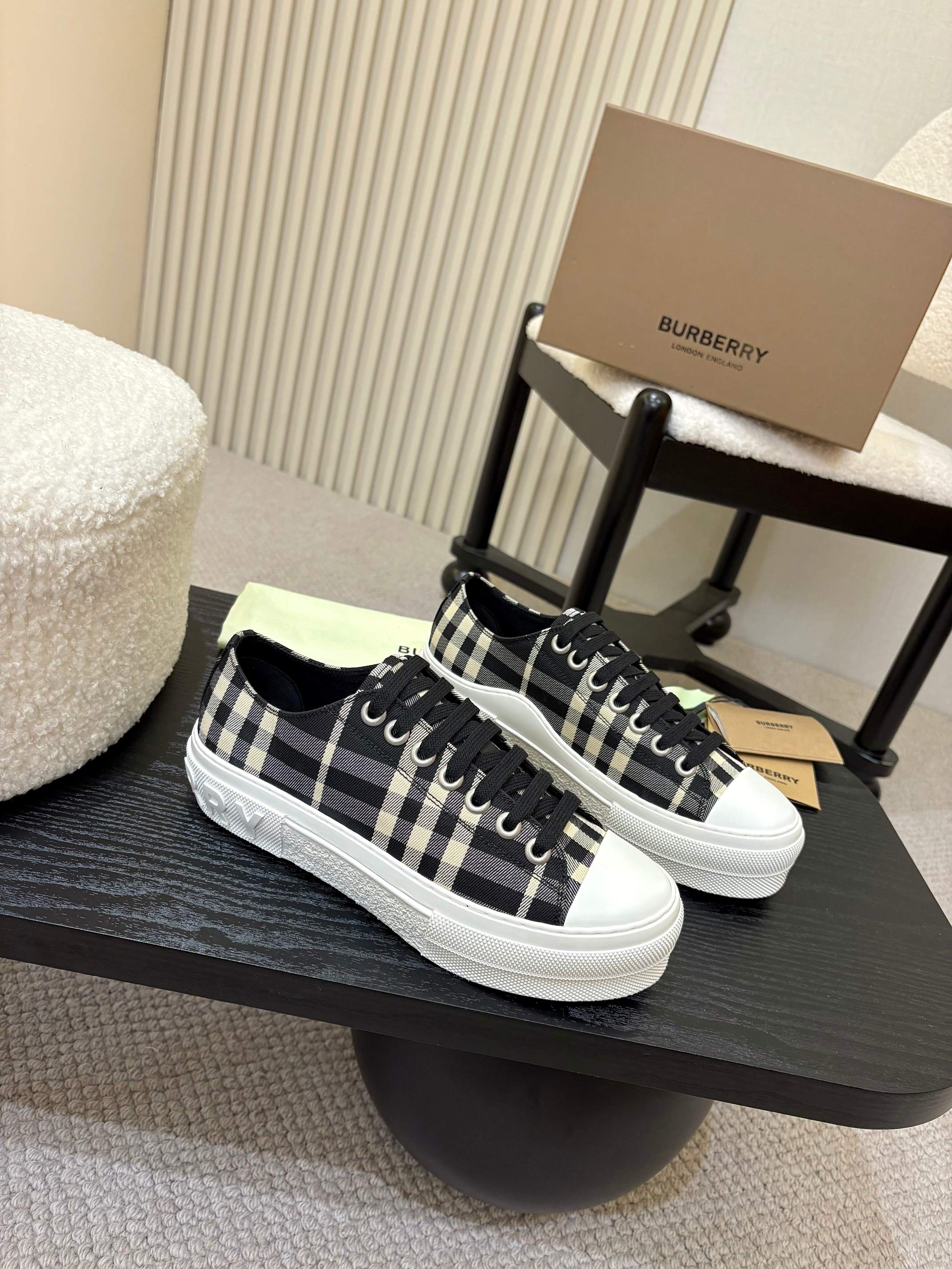 Burberry checkered lace-up sneakers with black and white plaid uppers, white rubber sole