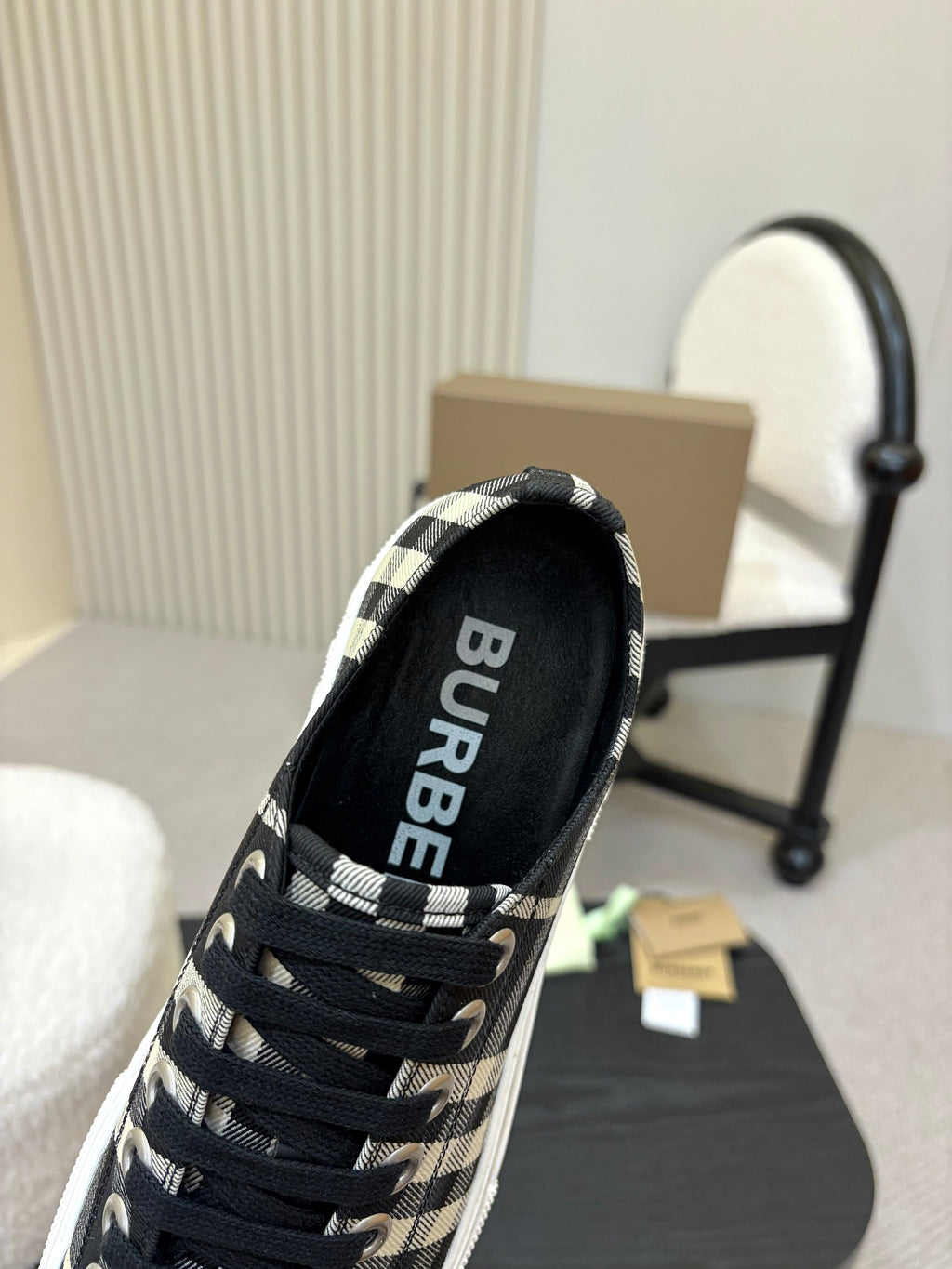 Burberry plaid sneaker heel view with black insole and lace-up front