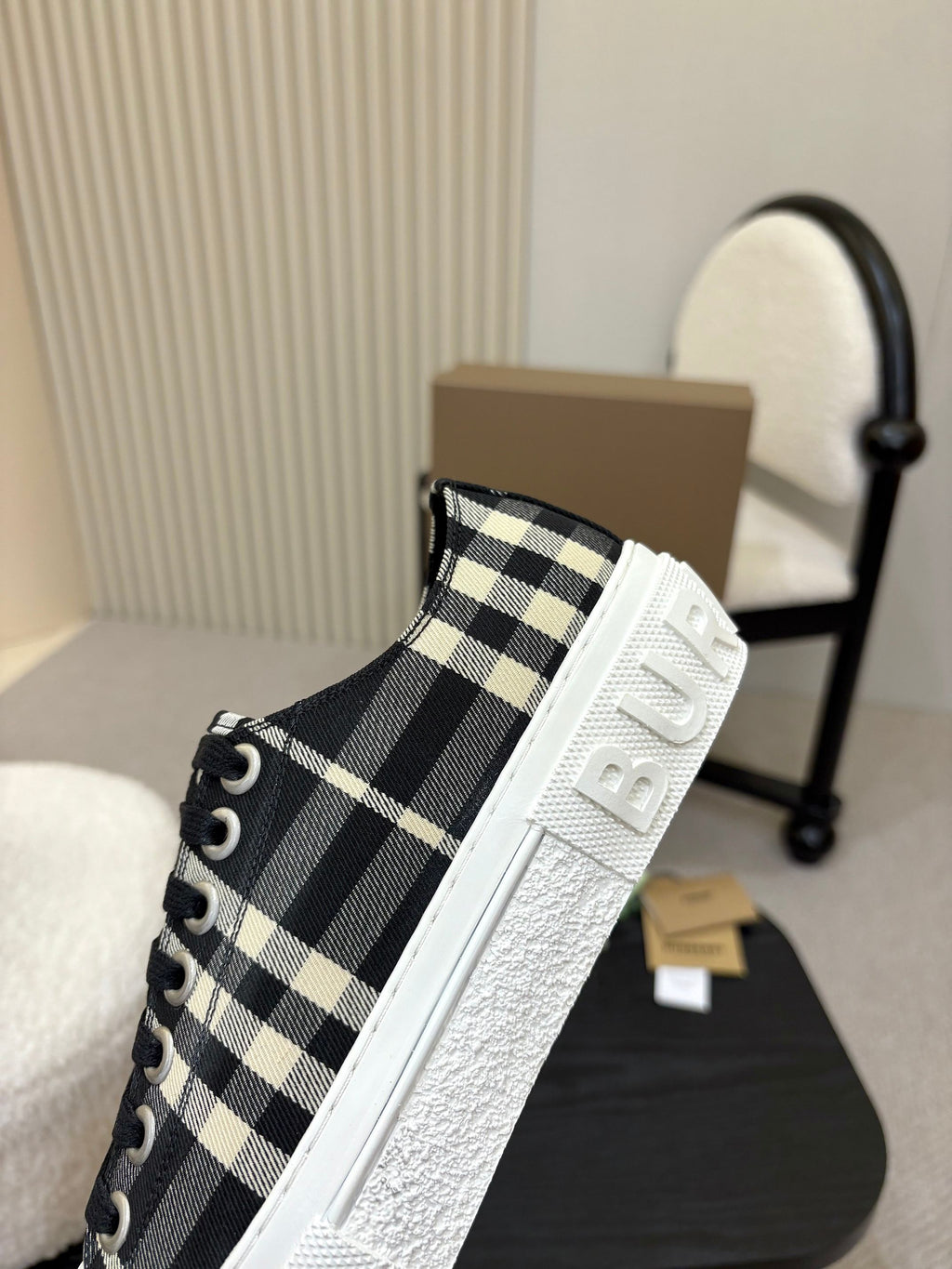 Burberry slip-on style sneaker with side stripe, black-and-white check textile and textured sole