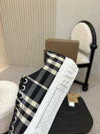 Burberry slip-on style sneaker with side stripe, black-and-white check textile and textured sole
