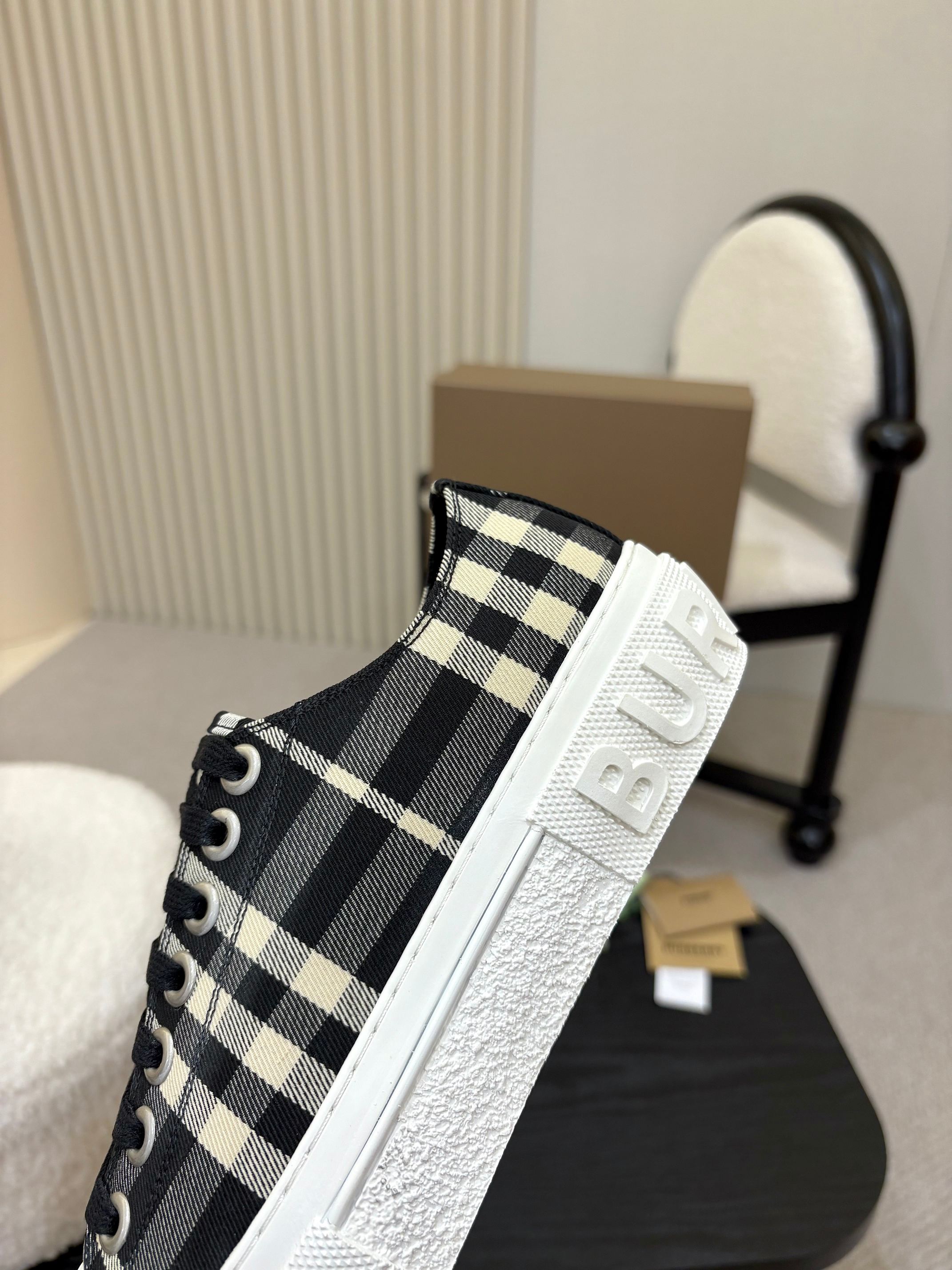 Burberry slip-on style sneaker with side stripe, black-and-white check textile and textured sole